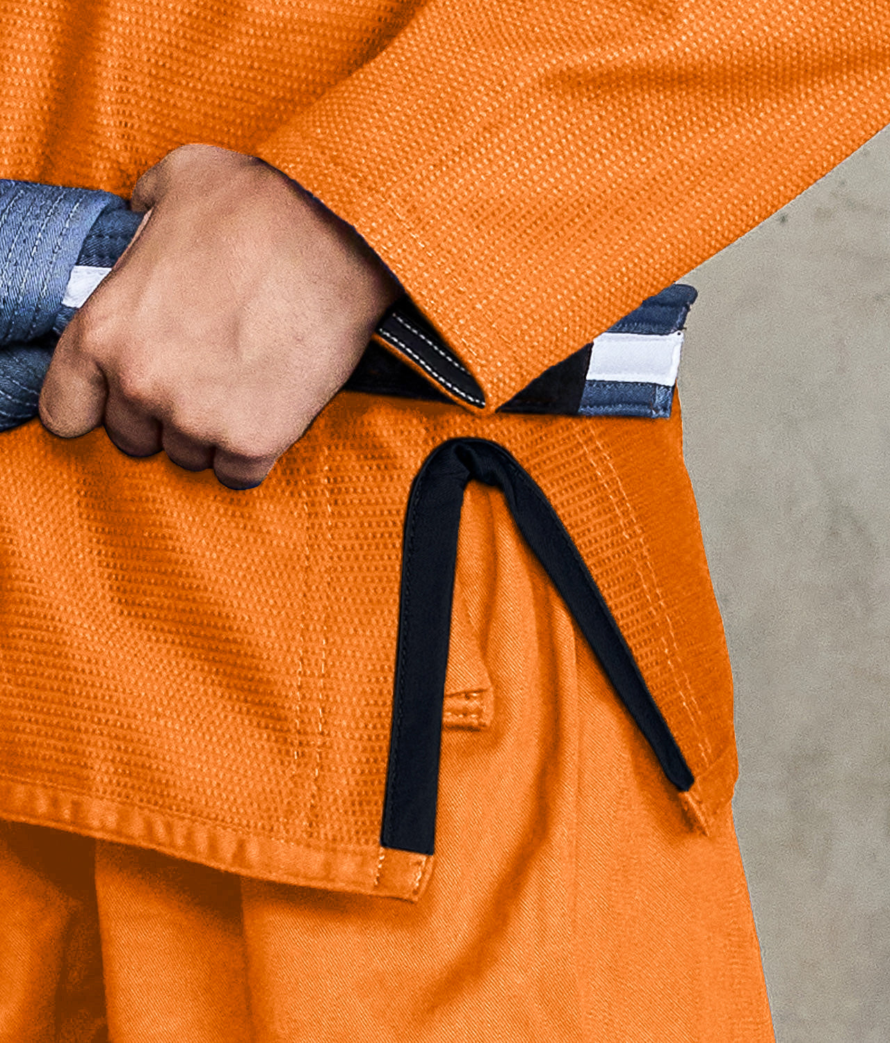 elite core orange boys preshrunk bjj gi closeup